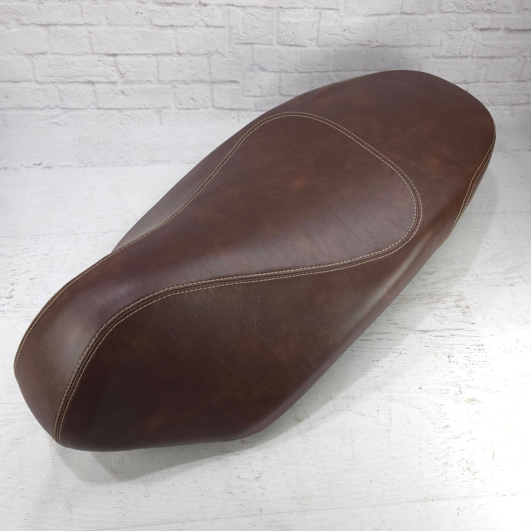 Piaggio Liberty whiskey brown seat cover with French seams, handmade by Cheeky Seats